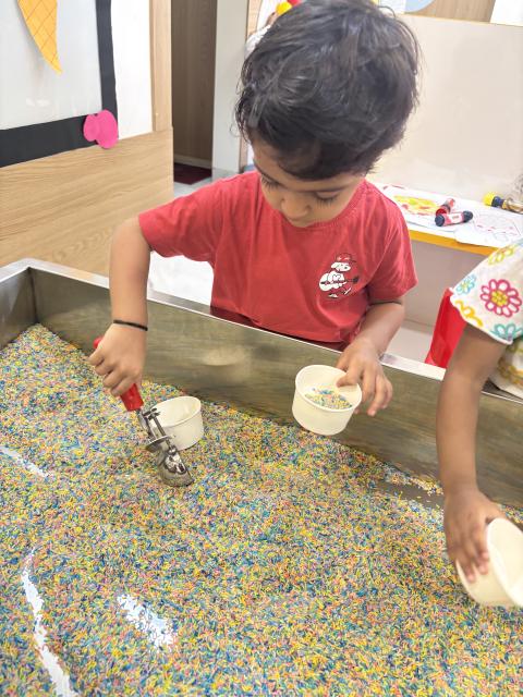 Busy hands scoop bin